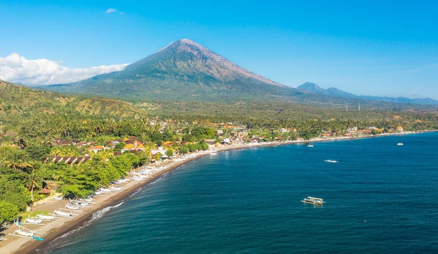 Peaceful coastline with volcanic views at Amed Beach, Bali, Indonesia