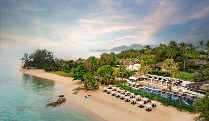 Luxury beachfront villas and infinity pool at Anantara Lawana Resort in Koh Samui.
