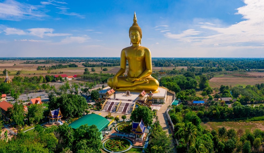 Golden 12-meter Big Buddha statue overlooking the sea at Wat Phra Yai in Koh Samui.