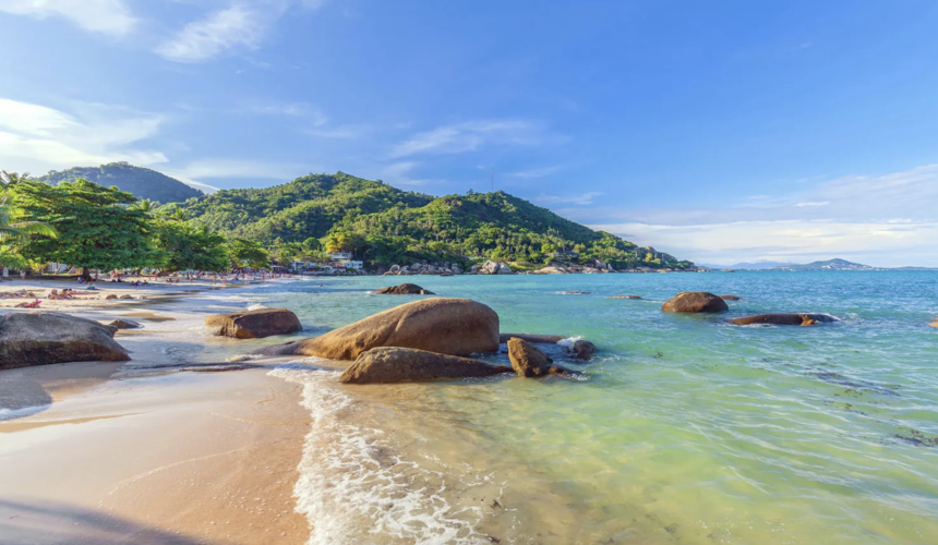 Secluded Silver Beach surrounded by palm trees and rocky headlands on Koh Samui’s east coast.