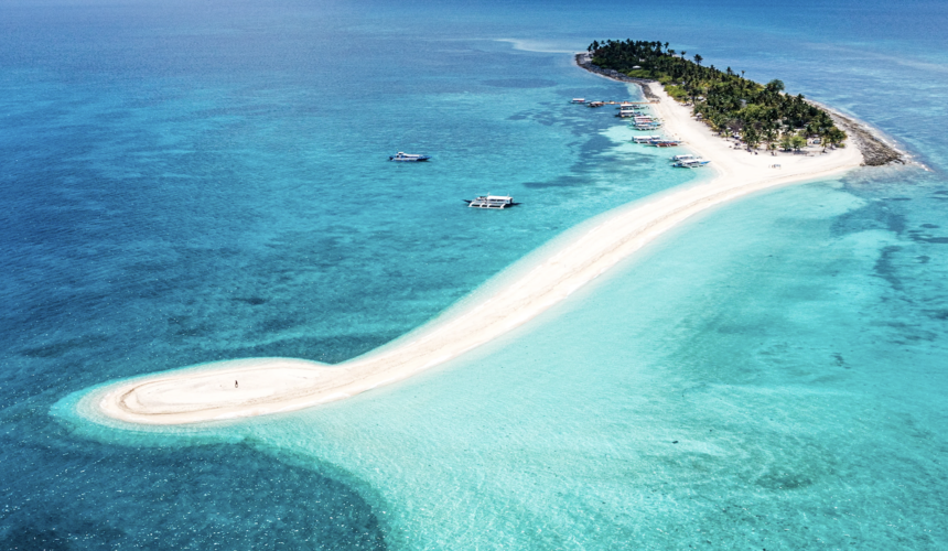 Crystal-clear waters and fishing boats near Bantayan Island Philippines